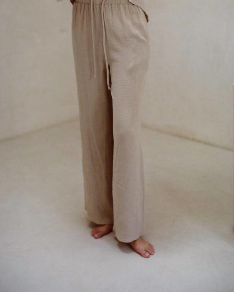 Front of a model wearing a size L Sunrise Sail Pants In Taupe in Taupe by By Together. | dia_product_style_image_id:355906
